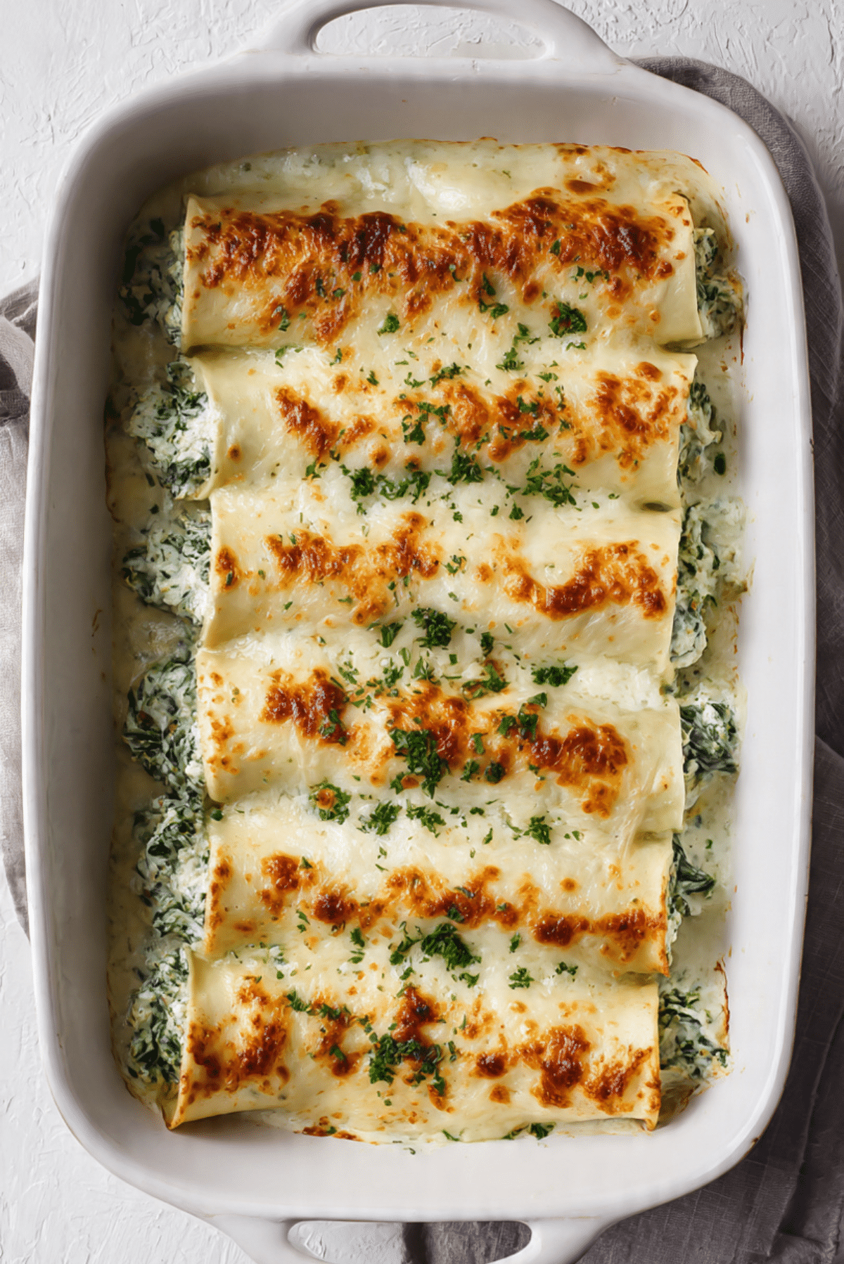 Cheesy Chicken Spinach Stuffed Crepes Bake